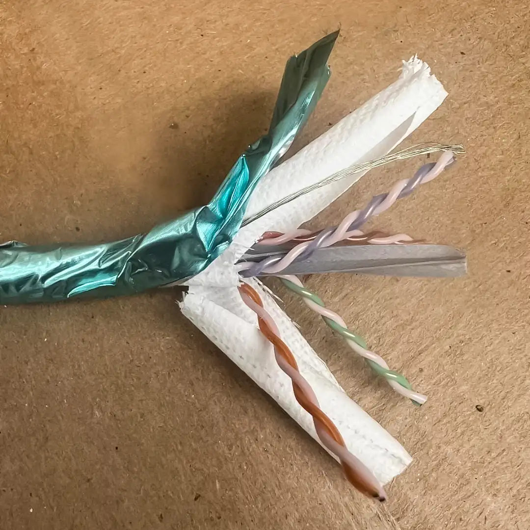 A cutaway showing the internal foil shield and twisted pairs of the GenSPEED Cat6A cable