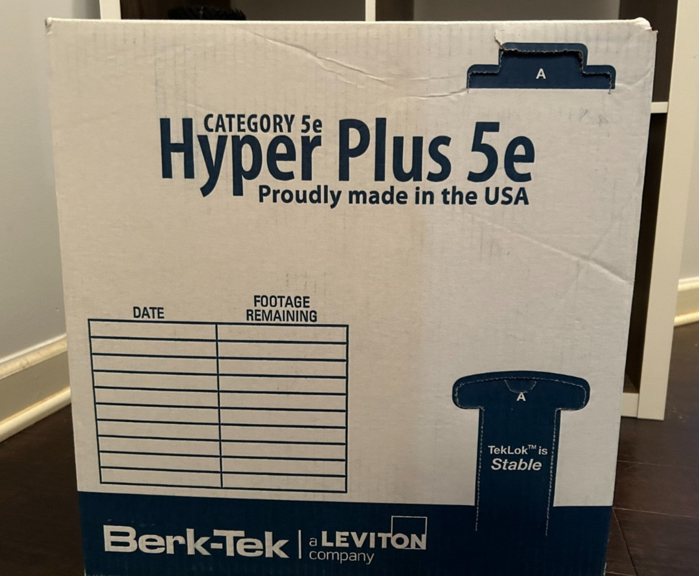 Side panel of the Berk-Tek HyperPlus 5e Cat5e cable box showing the footage table